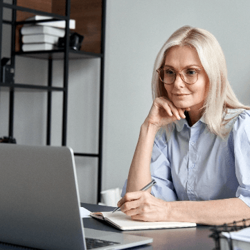 Older woman studying Bliblical Greek on her laptop